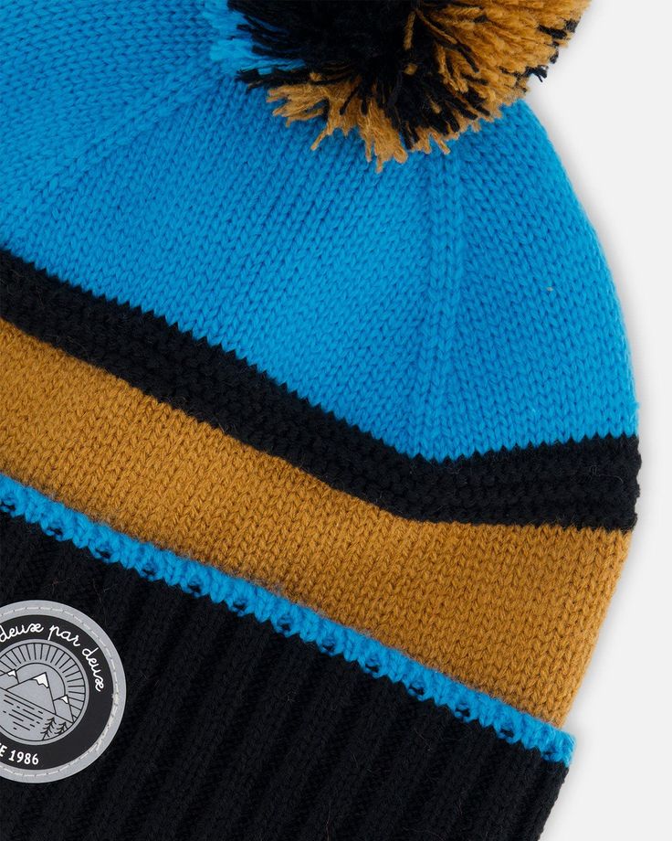 Our Knit Hat Blue, Black and Spice is a must-have on cold weather days. Oh-so-soft in acrylic yarn, this beanie hat features an easy pull-on fit with a cozy lining, a fluffy pompom on top, and a horizontal stripe pattern that makes it easy to mix and match with a variety of different coats and snowsuits. Beanie hat Pompom Logo patch 100% Acrylic - Lining: 94% Polyester, 6% Elastane Fits true to size From 2 years to 14 years Boys Knits, Dress Gift, Brand Collection, Snow Suit, Exclusive Bag, Kids Hats, Color Therapy, Knit Hat, Beanie Hat