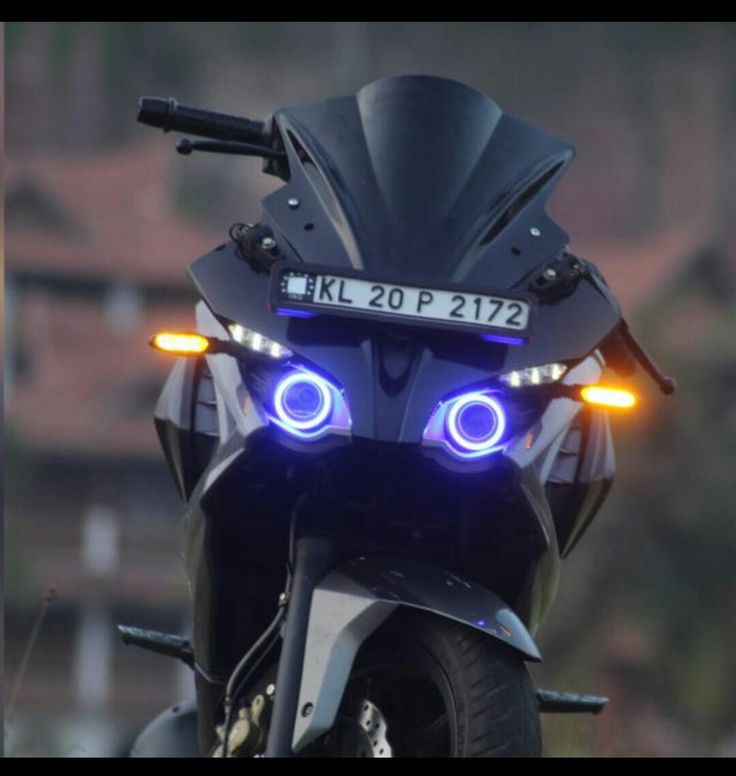 a motorcycle with its lights on is shown