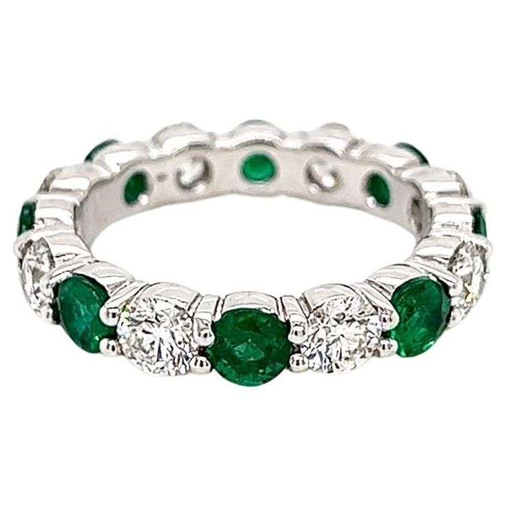 3.36 Total Carat Green Emerald and Diamond Ladies Ring Highly Polished 1.86 Carat Diamond Eternity Band with Green Emerald Gemstone Carat Weight of 1.50 CT. Specifications: -Metal Type: 18K White Gold -1.50 Carat Round Cut Columbian Green Emerald -1.86 Carat Round Natural Diamonds, G-H Color, VS2-SI Clarity -Size 6.25 Proudly made in New York City. Eternity Band Diamond, Diamond Eternity, Emerald Gemstone, Emerald Diamond, Eternity Bands, Ring Verlobung, Pandora Charm Bracelet, Emerald Green, Types Of Metal