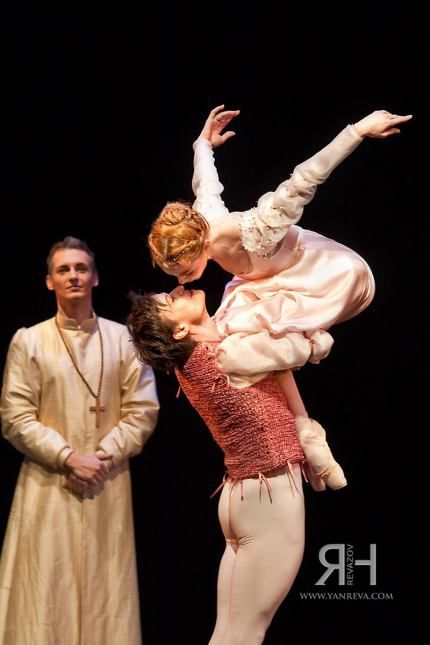 a man and woman are performing on stage