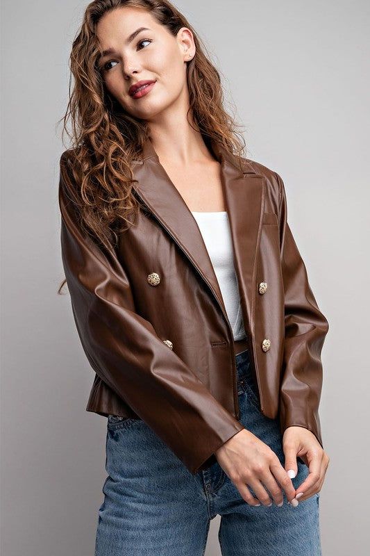 Cuteness to the max! This faux leather cropped moto jacket gives you the look of leather without the cruelty – plus the buttons in front make 'em do a double take! Dare to layer on and show the world who's boss! Fit : True to size 55% PU, 45% POLYESTER Lined Button closure Trendy Brown Cropped Jacket For Fall, Trendy Faux Leather Jacket With Snap Buttons, Faux Leather Jacket With Snap Buttons For Fall, Faux Leather Jacket With Button Closure For Fall, Fall Faux Leather Jacket With Snap Buttons, Double-breasted Leather Jacket With Buttons For Fall, Fall Double-breasted Leather Jacket With Buttons, Trendy Brown Blazer With Buttons, Spring Faux Leather Jacket With Button Closure