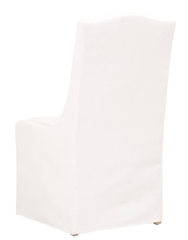 a white chair sitting on top of a wooden table