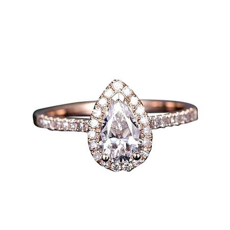 an engagement ring with a pear shaped diamond in the center