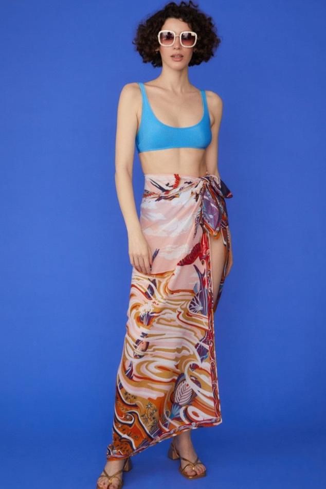 Wrap yourself in luxury with our Multi Tie-Waist Sarong, a versatile piece that exudes tropical elegance. Crafted from a sumptuous blend of cashmere, silk, and cotton, this sarong offers an incredibly soft touch while maintaining a lightweight, airy feel. The vibrant tropical print transports you to paradise, while the contrast hem adds a chic, defined edge. Designed with a flexible tie-waist, this one-size-fits-all sarong is perfect for beach days, poolside lounging, or adding a stylish layer t Moroccan Oil Hair, Cute Coverups, Holiday Vibes, Stylish Skirts, Pool Side, Long Sleeve Outerwear, Medical Aesthetic, Womens Cashmere, Beauty Favorites