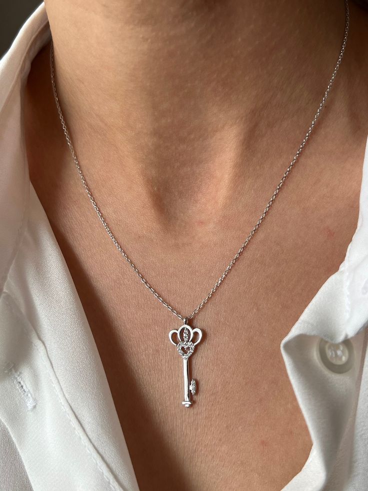 Get this stylish key to keep your high energy 🔑 Get this beautiful minimalist jewelry made with the quality of perfect elements✨ You can choose 925K Sterling Silver with the options of Gold, Rose Gold or White Gold colors. High quality jewelry for everyone 🤍  Details * 925K Sterling Silver Option → 14K Gold, Rose Gold or White Gold plated * Chain length is approximately 18 inches (16+2 in extender) / 45 cm (40+5 cm extender) * Time is everything! You will receive your package as soon as possible 🚚  * We care about the quality of metal to make sure it will last for a long time * We use enamel technique to color the jewelry and high quality zircons only * There can be tiny differences on each item. Length difference of the chain as well as color changes and shade differences of the stones Elegant Heart-shaped Key Jewelry, Elegant Sterling Silver Key Jewelry, Elegant Sterling Silver Key Necklace, Elegant Two Keys Necklace As Gift, Elegant Two Keys Necklace Gift, Elegant Two Keys Necklace For Gift, Time Is Everything, Lock Necklace, Love Jewelry