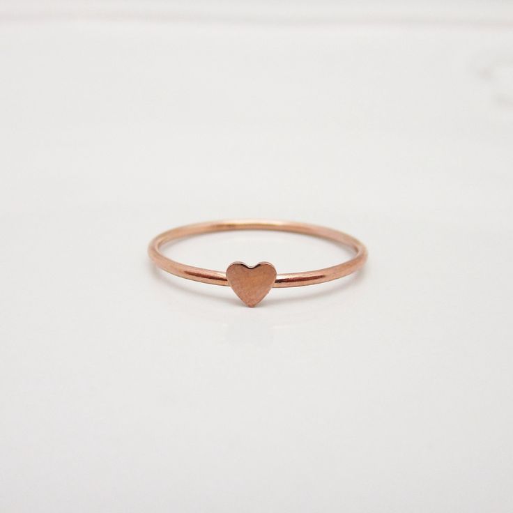 REAL ROSE GOLD FILLED 14/20 I love how this adorable little heart ring turned out and am so happy to share it with you! The dainty band features a polished surface, accented with a tiny heart that measures approximately 3-4 mm. The lovely rose gold color is perfect for this minimalist piece. Great for stacking up with other rings but also beautiful when worn alone. STERLING SILVER, GOLD, OR ROSE GOLD: This listing is for a ring in rose gold filled. However, I can also make these in yellow gold f Heart-shaped Rose Gold Stackable Rings As Gift, Rose Gold Heart-shaped Stackable Rings As Gift, Dainty Rose Gold Heart Ring For Everyday, Dainty Rose Gold Heart Ring With Charm, Heart-shaped Dainty Midi Rings For Valentine's Day, Dainty Heart-shaped Midi Rings For Valentine's Day, Dainty Tiny Heart Ring For Valentine's Day, Delicate Heart Ring For Everyday Valentine's Day, Delicate Everyday Heart Ring For Valentine's Day