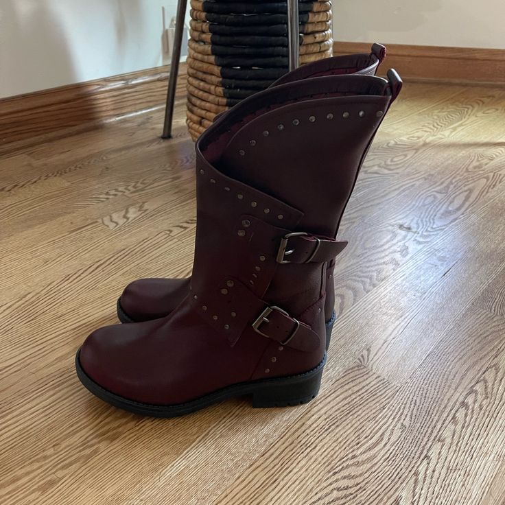 Very Nice Leather Moto/Biker Style Boot. They’re Like A Merlot Color. Super Stylish! Never Worn. True To Size. I’m 5’3” And They Come Up To My Calf Area. Message Me With Questions! Brown Biker Moto Boots With Round Toe, Brown Moto Boots With Rivets For Winter, Winter Leather Combat Boots With Rivets, Brown Biker Moto Boots With Buckle Closure, Brown Edgy Moto Boots For Winter, Brown Biker Moto Boots For Winter, Brown Biker Boots For Fall, Brown Ankle Moto Boots With Rivets, Brown Fall Boots With Studded Rubber Outsoles