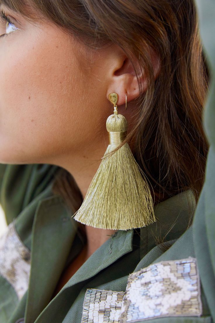 FINAL SALE Life is short. More is more. Introducing the Majors: an oversized, luxe version of our best-selling tassel earrings. These babies are begging to be worn on the dance floor or to a cocktail party. Metallic champagne thread shines in the light (or under a disco ball). They pack the punch of a big statement earring, without weighing down your ears. Featherlight and kinda fancy. Dress them up or down. Details: Featherlight polyester tassel. Thread is stiff and holds its shape well. 14 kar Chic Dangle Tassel Earrings For Party, Gold Elegant Tassel Earrings For Party, Elegant Summer Tassel Earrings For Party, Chic Evening Earrings With Tassels, Gold Fringe Earrings For Summer, Summer Gold Tassel Earrings, Gold Dangle Tassel Earrings For Spring, Tassel Earrings For Wedding, Elegant Tassel Earrings For Party