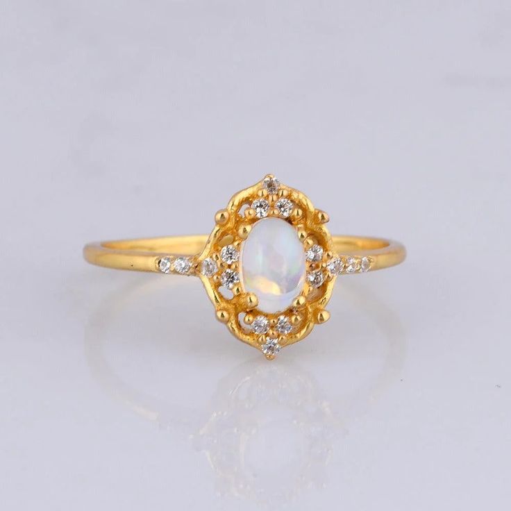 Cosmic Opal Ring – Tippy Taste Jewelry Gold Ethiopian Opal Heirloom Rings, Heirloom Ethiopian Opal Gold Rings, Gold Opal Ring With Spiritual Style, Celestial Style Opal Ring, Gold Ethiopian Opal Ring Hallmarked, Celestial 14k Gold Opal Wedding Ring, Gold Opal Birthstone Ring, Gold Opal Ring With Birthstone, White Opal Celestial Ring