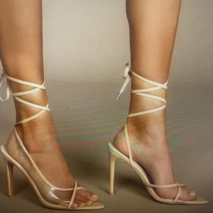 Vinyl Nude Pointed Toe Heels- Laces Are Long And Tie Around The Ankle. New Without The Box Beige High Heel Lace-up Sandals For Party, Beige Lace-up Sandals For Party, Beige Strappy Lace-up Sandals For Party, Strappy Beige Lace-up Sandals For Parties, Beige High Heel Lace-up Sandals For Evening, Beige Lace-up Sandals With Heel Strap For Party, Cream Strappy Heels For Party, Cream Strappy Heels For Evening, Cream Strappy Heels With Wrapped Heel