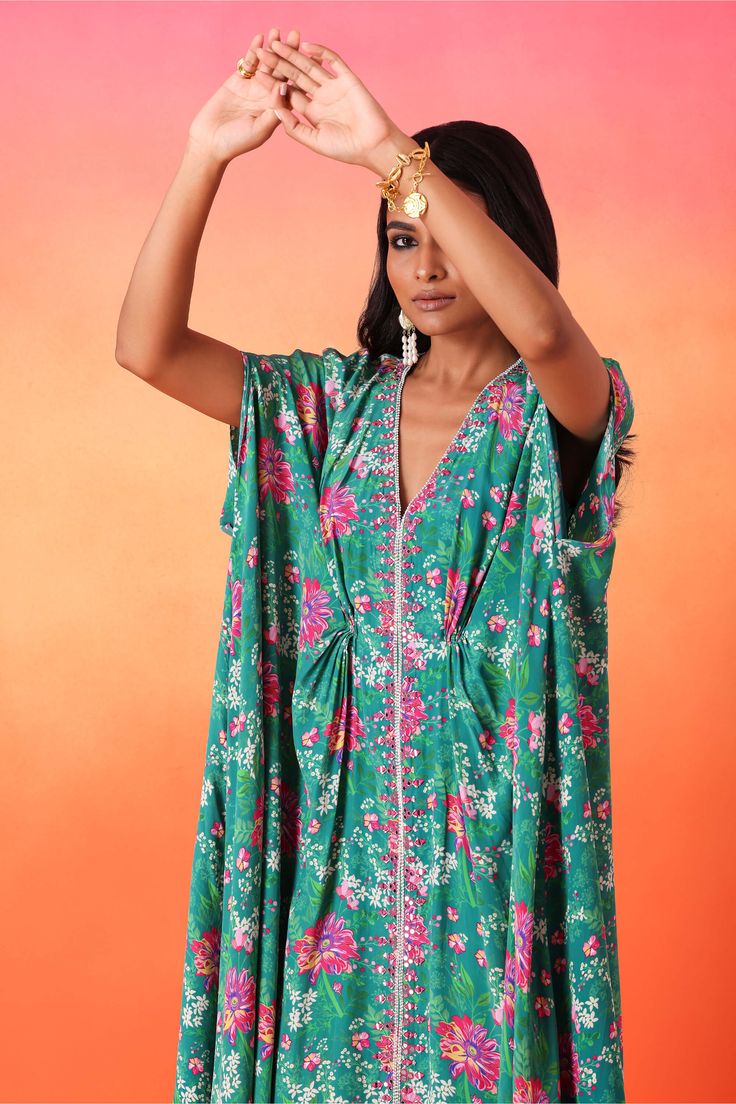 Editor's Note Presenting a stunning embellished printed full-length kaftan, exuding elegance and sophistication in one mesmerizing ensemble. This kaftan is adorned with intricate embellishments, adding a touch of glamour and grace to the outfit. Embrace the beauty of this ensemble for any special occasion and let your fashion sense shine with confidence and charm. Fabric: Printed crepe, satin lining Color: Green Components: Kaftan Occasion: Festive Note: Product colour may slightly vary due to p Green Kaftan, Kaftan For Women, Printed Kaftan, Neck Flower, Floral Color, Green Print, Printed Sleeves, Neck Pattern, Floral Printed