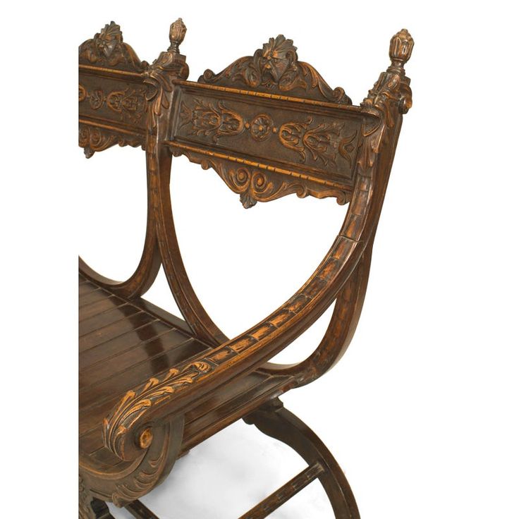 an antique wooden rocking chair with carved details