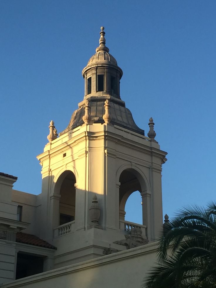 the top of a building with a clock on it