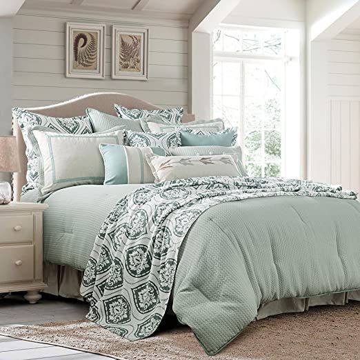 the comforter is neatly made and ready to be used in the bedroom or living room