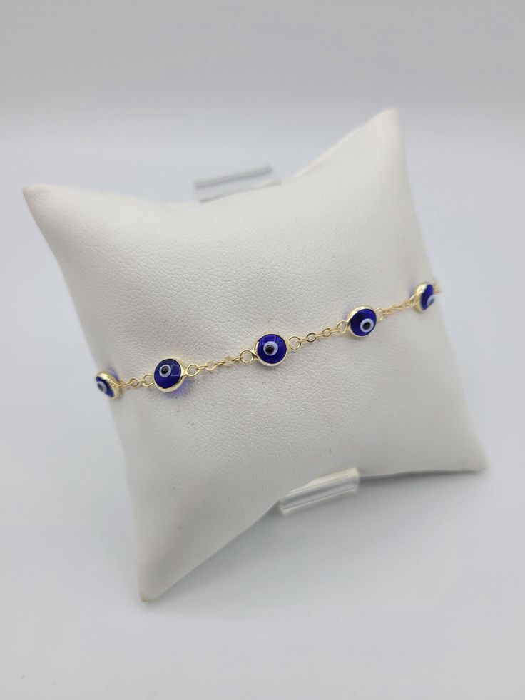 14k Yellow Gold Evil Dark Blue Eye Bracelet-Length 7". Shipped with USPS First Class. NEW-14k Yellow Gold Evil Eye Bracelet. Weight: 2.5g Approximately  Length: 7" Elegant Blue Chain Bracelet As Gift, Elegant Blue Chain Bracelet For Gift, Elegant Adjustable Blue Gold Bracelet, Elegant Blue Adjustable Gold Bracelet, Elegant Blue Gold-plated Bracelets, Elegant Blue Evil Eye Bracelet, Fine Jewelry Blue Gold Bracelet For Gift, Blue Gold Bracelet With 17 Jewels For Gift, Blue Gold Bracelet For Gift, Fine Jewelry