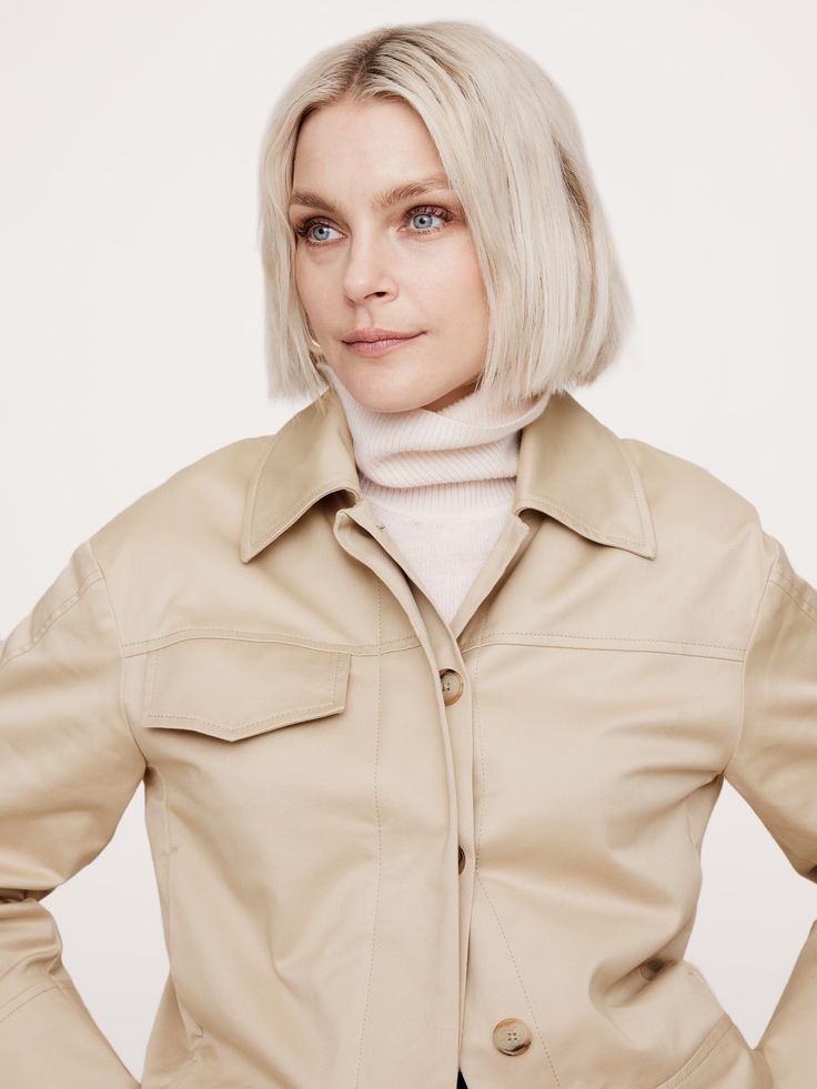 An ode to 90s minimalism, we pared back the utilitarian detailing for this short jacket, opting for a concealed button placket and welt pockets at the front.  We cut this one in a beautiful stretch-cotton sateen fabric, one we love for its dressed-up appearance.  Warm: Unlined.  Relaxed fit.  Point collar with concealed button front.  Side seam and single chest pockets.  Unlined.  Relaxed fit.  Long sleeves.  Hip length.  Model: Size S, 5'10" (178cm). Chic Collared Utility Jacket With Flap Pockets, Chic Button-up Utility Jacket With Flap Pockets, Spring Cropped Jacket With Patch Pockets For Work, Modern Collared Outerwear With Patch Pockets, Workwear Cropped Button-up Jacket With Patch Pockets, Utility Style Cropped Jacket With Flap Pockets, Modern Utility Jacket With Pockets For Work, Utility Cropped Jacket With Flap Pockets, Button-up Cropped Jacket With Patch Pockets For Work