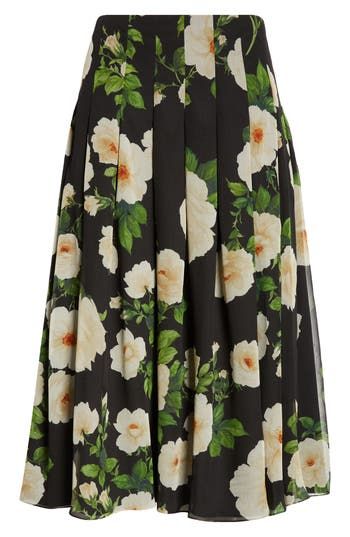 The fashion house's fascination with florals continues in this stunning A-line midi skirt shaped with crisp box pleats and cut from lightweight silk. 100% silk Dry clean Made in Italy Designer Clothing Hispanic & Latinx Owned/Founded Silk Midi Skirt, Black Midi Skirt, Box Pleats, Carolina Herrera, Fascinator, The Fashion, Midi Skirt, Designer Clothing, A Line