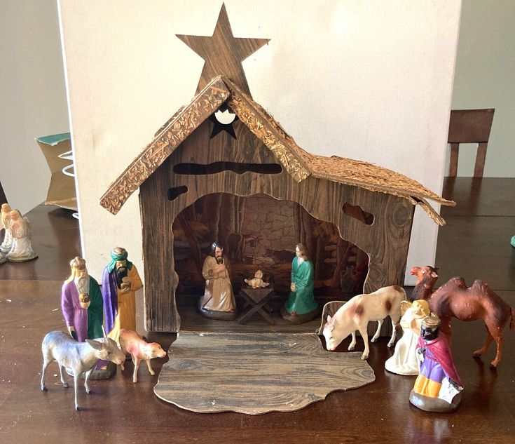 a nativity scene with figurines and animals