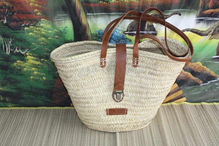 SUPERB 100% natural and leather bag. PREMIUM BRAIDING BASKET HULÉTI. Long leather handles and leather flap with superb quality case closure. Ideal for the market and for your shopping. Ideal for a picnic or for the beach. HAND-CRAFTED MANUFACTURING. UNIQUE MODELS MANUFACTURED IN VERY LITTLE EXEMPLARY. Dimensions: Length 45cm / Height 30cm. Dimensions may vary slightly for the same model. Very trendy & original. Very resistant over time. Nice finishes. Material: palm tree ESPECIALLY DO NOT HESITATE TO CONTACT ME BEFORE ORDERING FOR ANY QUESTIONS. I GENERALLY RESPOND QUICKLY. Classic Natural Bag With Braided Handles, Classic Natural Bags With Braided Handles, Classic Straw Bag With Leather Handles For Travel, Classic Straw Tote Bag For Everyday Use, Classic Straw Bag With Braided Handles For Travel, Classic Natural Straw Bag For Everyday Use, Classic Natural Straw Bag For Travel, Classic Natural Straw Tote Bag, Classic Natural Straw Travel Bag