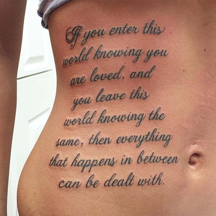 a woman with a tattoo on her stomach that says if you enter this world, having you