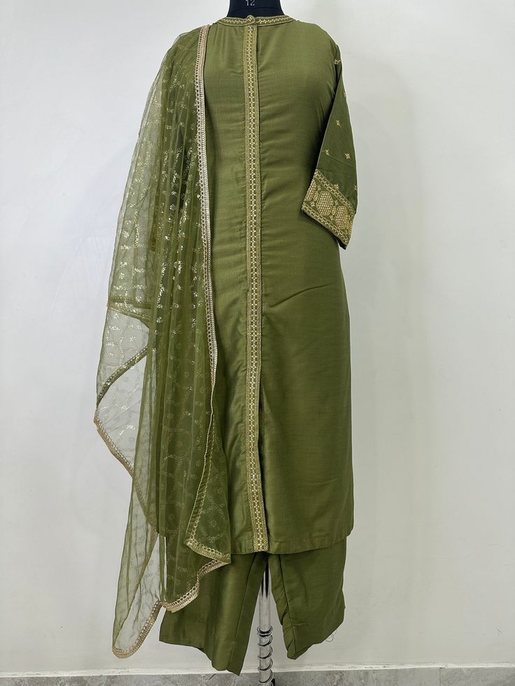 Indian Wedding Wear Salwar Kameez / Indian Ethnic Dress / Plus Size Silk Kurta Dress Traditional Indian Wear / Salwar Kameez Dupatta / Kurti Palazzo Set / Party Wear/ Silk Kurta Set ITEMS DETAILS:- Olive Green Sequinned design Kurta with Trouser and Dupatta Kurta design: * Sequinned Work  * Straight shape * Regular style * Band Neck  * Three-quarter regular sleeves * Calf length with straight hem * Silk blend woven fabric Palazzos design:  * Solid Trousers 1 Pocket  * Partially elasticated waistband * Slip-on closure Dupatta length: 2 metres (approx.)  Top fabric: Silk Blend Bottom fabric: Silk Blend Dupatta fabric: Net Hand Wash NOTE:- please see the size chart in the image to choose a perfect size. Please feel free to ask any question regarding this item. WE ALSO ACCEPT CUSTOMISATION AS Festive Semi-stitched Straight Kurta Salwar Kameez, Pista Green Semi-stitched Suit For Diwali, Semi-stitched Long Anarkali Kurta, Fitted Green Dola Silk Sets, Semi-stitched Cutdana Dresses For Eid, Bollywood Style Silk Kurta For Transitional Season, Traditional Fitted Cotton Silk Dress, Festive Cotton Silk Dress With Traditional Drape, Fitted Dresses With Cutdana For Eid