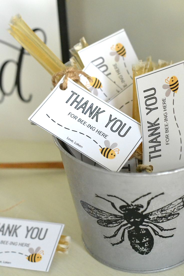 a bucket filled with bees and thank you tags