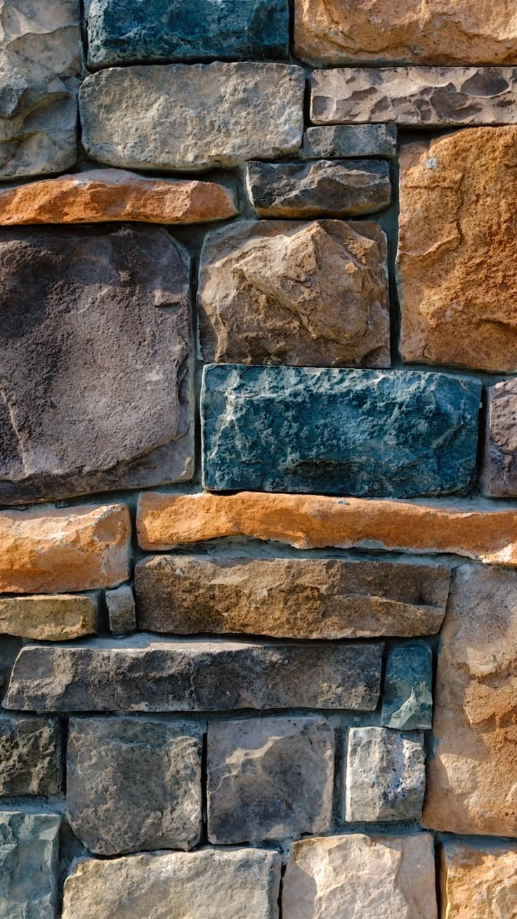 a black and white photo of a stone wall