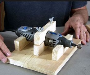 a man is working with some kind of tool on a piece of wood that's being worked on