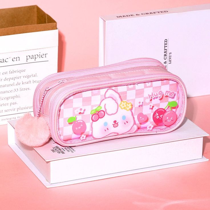 🐰🌸 Sweet Bunny Pencil Case: Whimsical and Practical 🌸🐰 Introducing the Sweet Bunny Pencil Case, a charming and functional accessory that adds a touch of whimsy to your school or office supplies. 🐰 Adorable Design: This pencil case features a sweet bunny face and soft pastel colors, making it a delightful addition to your daily routine. 🌸 Organized Essentials: Keep your pens, pencils, erasers, and other stationery items neatly organized and easily accessible with this spacious and cute penc Playful Portable Pencil Case For School, Cute Pencil Case With Pen Holders, Cute Pencil Case With Pen Holders For Students, Cute Pencil Case With Cute Design For School, Cute Portable Pencil Case, Pink Portable Rectangular Pencil Case, Portable Pink Pencil Case For Students, Cute Kawaii Pencil Case For School, Pink Rectangular Pencil Case For School