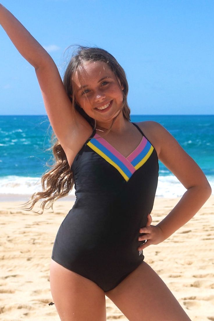 This fun & sporty one-piece swimsuit is a new favorite!! The cut & style is back by popular demand, and for good reason! Here are a few of our favorite features of the Rikki: Elastic bands in RAD colors: yellow, blue & pink Adjustable back-ties to fit all body types Sewn-in padding (sizes 12-16 only) Embroidered RAD logo on hip Fully lined in our signature embossed motto “you are beautiful” Playful Black Swimwear For The Beach, Striped Stretch One-piece Swimwear, Playful Striped Swimwear For Beach, Playful Striped Swimwear For Beach Season, Striped Stretch Swimwear For Sports, Striped Fitted Swimwear For Sports, Sporty Striped Swimwear For Beach Season, Casual Striped One-piece Swimwear, Playful Striped Swimwear For Poolside