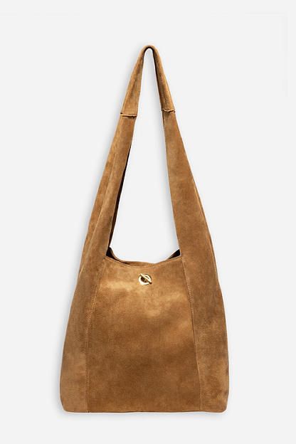 Crafted from 100% rich suede, the Tassel Chain Italian Suede Hobo Bag is perfect for daily use. Featuring a comfortable shoulder strap and wide top opening, this classic hobo style bag is finished with a decorative leather tassel at the front and a hook and eye closure. Pair with relaxed fit jeans and a casual blouse for a classic weekend look. Johnny Was Women's Tassel Chain Italian Suede Hobo Bag in Tan Brown, Leather/Suede Elegant Everyday Suede Hobo Bag, Elegant Suede Hobo Bag For Everyday Use, Chic Suede Hobo Bag With Suede Lining, Chic Suede Hobo Bag With Soft Leather, Suede Shoulder Bag With Gold-tone Hardware For Travel, Chic Leather Hobo Bag With Suede Lining, Versatile Suede Hobo Bag With Soft Leather Details, Versatile Suede Hobo Bag With Soft Leather, Chic Soft Suede Hobo Bag