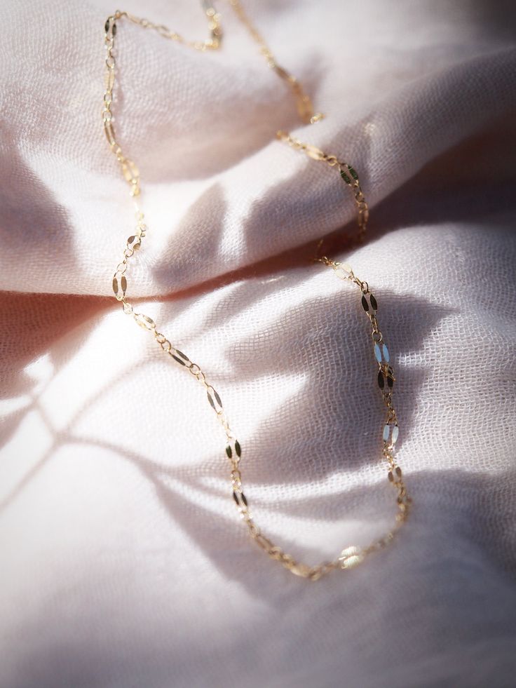 A super sparkly basic chain your gold necklace collection, our delicate gold dapped chain is the perfect everyday necklace. Made from 14kt Gold Filled, this versatile chain is the perfect layering essential.✦ DETAILS ✦✧ Name: Hokupa'a (hoo KOO leh) - star wreath.✧ 14kt Gold Filled.✧ All Ke Aloha Jewelry pieces come packaged thoughtfully, beautifully, and ready for gift giving.✧ Unless otherwise noted in the listing description, all pieces are sold individually. Photos with models/multiple pieces Delicate Gold-plated Chain Necklace, Everyday Delicate Chain Necklace, Gold Plated Delicate Chain Necklace, Delicate Everyday Figaro Chain Necklace, Everyday Delicate Figaro Chain Necklace, Delicate 14k Gold-filled Paperclip Chain Necklace, Delicate Satellite Chain Necklace For Everyday, Delicate Gold Figaro Chain Necklace, Delicate Gold Chain Necklace With Figaro Chain