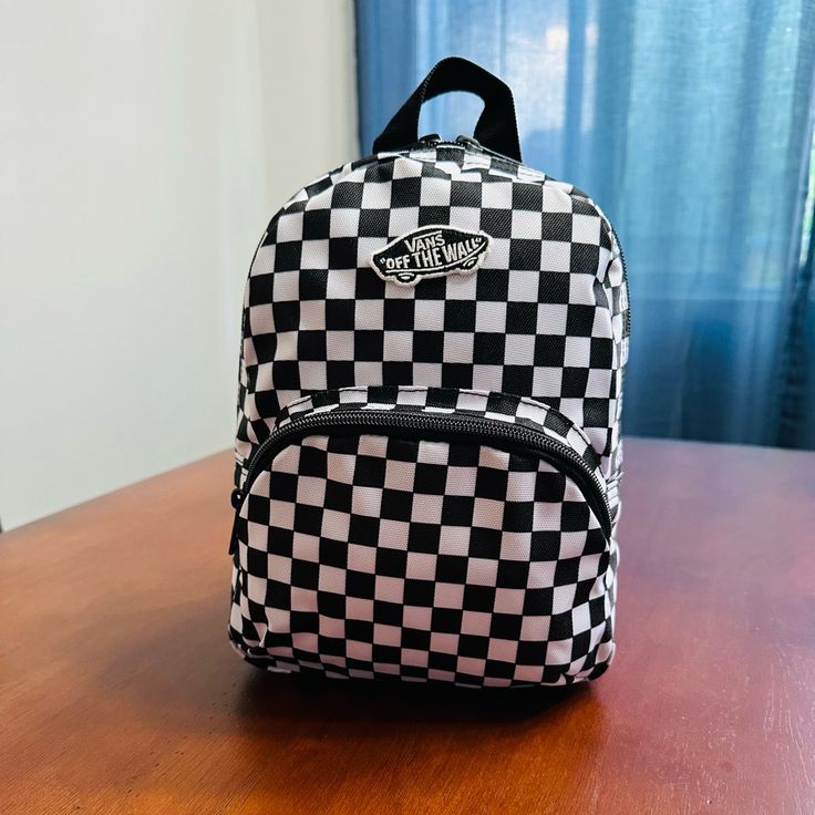 Mini Backpack With Classic Checkerboard Design Front Zippered Pocket Approx. Size: 8” X 10” X 5” Vans Rectangular Bag For Daily Use, Vans Rectangular Bag For Everyday, Trendy Vans Travel Bag, Vans Backpack For School, Vans Backpack For Everyday And Back To School, Casual Vans Backpack For Daily Use, Casual Vans Bag With Adjustable Strap, Vans Casual Bag With Adjustable Strap, Vans Everyday Backpack