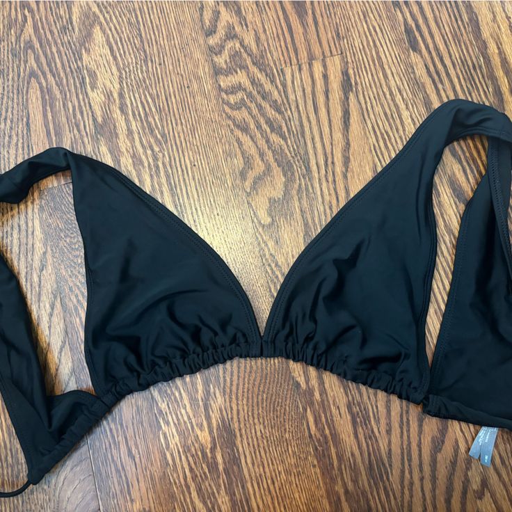 Never Worn, Perfect Condition Fits True To Size No Padding Beachwear Triangle Halter Top For Night Out, Chic Black Halter Neck Swimwear, Black T-back Swimwear With Built-in Bra, Black Backless Halter Top With Built-in Bra, Summer Black T-back Swimwear, Black T-back Halter Top For Poolside, Black T-back Swimwear For Party, Black Triangle Top Swimwear For Vacation, Black T-back Party Swimwear