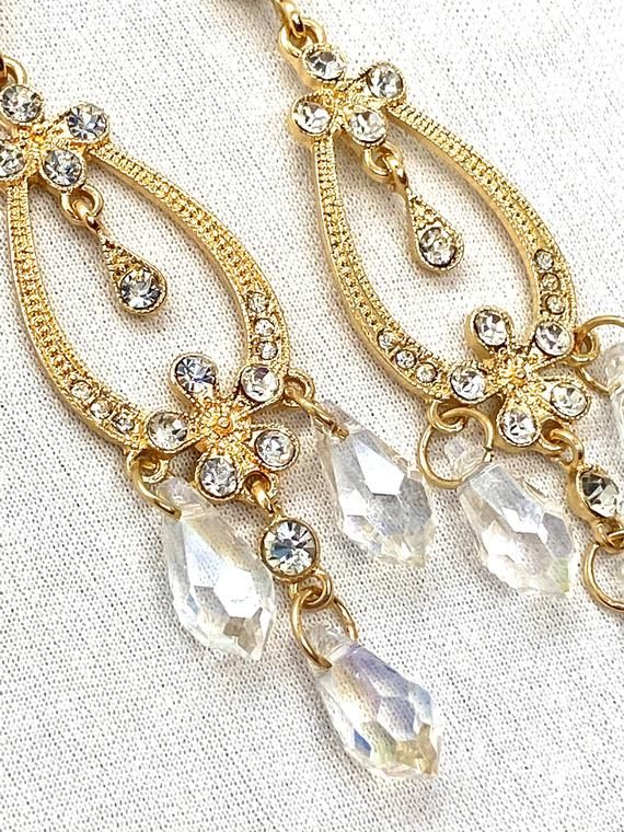 Belle Rhinestone Crystal Earrings Chandelier Beauty and Beast Jeweled Teardrop Crystal Chandelier Earrings, Sparkling Gold Metal Chandelier Earrings, Crystal Chandelier Drop Earrings, Gold Crystal Chandelier Earrings With Rhinestones, Teardrop Crystal Chandelier Earrings For Pierced Ears, Teardrop Crystal Chandelier Earrings, Gold Metal Chandelier Earrings With Rhinestones, Gold Sparkling Dangle Teardrop Earrings, Jeweled Crystal Dangle Chandelier Earrings