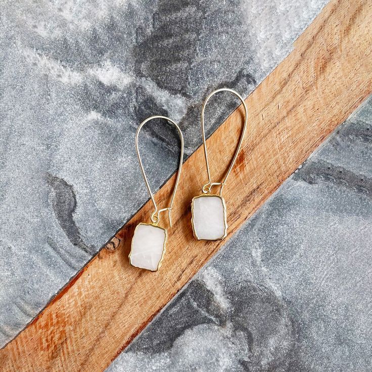 Where the timeless elegance meets modern vibes, that's where you'll find these drop earrings. GEMSTONE: Available in Turquoise, Milky white quartz, Lapis, Labradorite, Bumble bee jasper, and Black onyxCLOSURE: Gold plated kidney ear wiresLENGTH: 2" long Minimalist Adjustable Crystal Earrings, Minimalist Natural Stone Earrings, Minimalist White Teardrop Earrings, Adjustable White Crystal Earrings For Gift, White Crystal Gemstone Drop Earrings, Minimalist Jewelry With Natural Stone Drop Earrings, Minimalist Natural Stone Drop Earrings, Adjustable Nickel-free White Teardrop Earrings, White Minimalist Teardrop Dangle Earrings