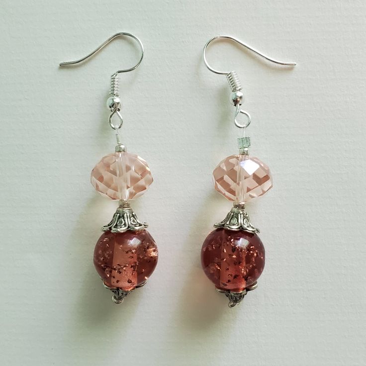 "\"PRISTINE PINK\" earrings These pretty pink earrings are made up of pale pink faceted glass beads, vintage round pink acrylic beads, silver etched metal beads, and silver seed beads. Approximate Measurements: Earring Length - 2.25 inches Earring Drop Length - 1.5 inches Earring Width - .5 inch *These earrings arrive in a handmade, hand-decorated box." Pink Glass Jewelry With Faceted Beads, Nickel-free Pink Beaded Earrings, Pink Dangle Jewelry With Faceted Beads, Pink Round Glass Jewelry, Pink Glass Round Jewelry, Pink Glass Jewelry For Jewelry Making, Elegant Pink Crystal Earrings With Round Beads, Pink Nickel-free Beaded Drop Earrings, Pink Round Beaded Earrings With Dangling Beads