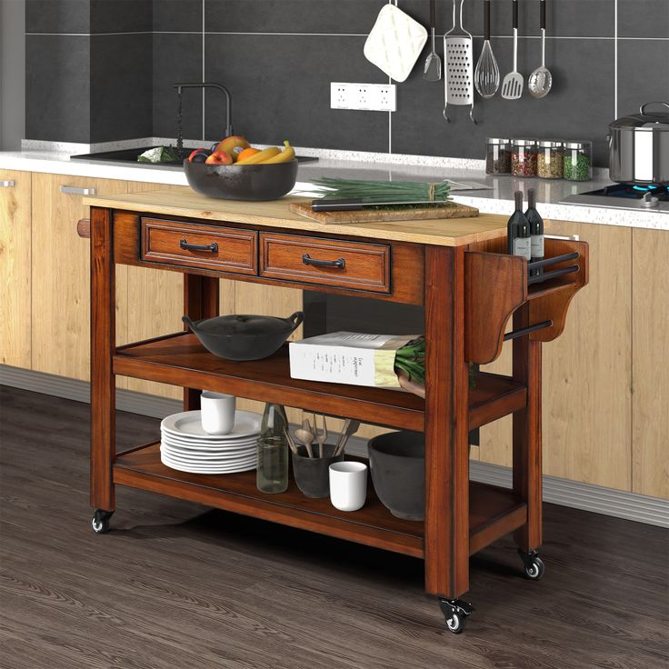 a kitchen island with pots and pans on it in the middle of a room