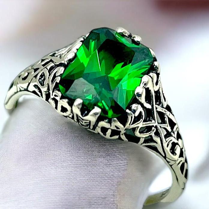 Unlock the timeless elegance of our Vintage Emerald CZ Solitaire Ring, a stunning piece crafted from 925 solid sterling silver. Adorned with exquisite filigree detailing, this ring is not just a piece of jewelry; it's a heartfelt expression of love, perfect for birthdays or anniversaries. The striking emerald-inspired gemstone, the birthstone of May, captures the eye and elevates any outfit. Surprise someone special or treat yourself to a symbol of enduring beauty and elegance. Embrace your unique style--add this enchanting ring to your collection today! Excellent Condition, Satisfaction Guaranteed! May Birthstone Classic Cubic Zirconia May Birthstone Ring, Classic Cubic Zirconia Birthstone Ring For May, Elegant Filigree Emerald Ring For Formal Occasions, Elegant Engraved Emerald Jewelry, Elegant Formal Emerald Ring With Filigree, Elegant Formal Emerald Filigree Ring, Emerald Rings With Intricate Design For Anniversary, Elegant Engraved Emerald Ring For Formal Occasions, Classic Silver Emerald Birthstone Ring