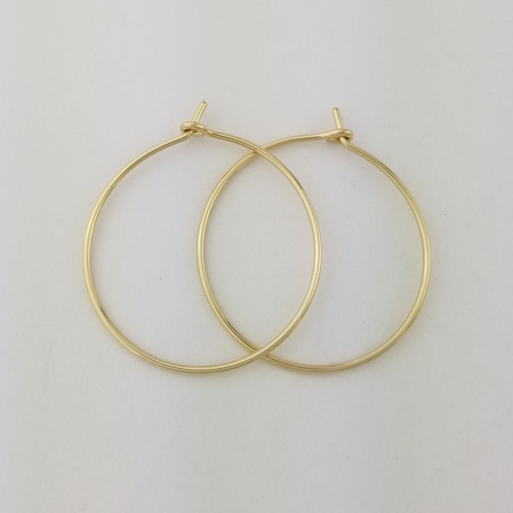 "Lovely 18 gauge, Solid 14k Gold Hoop Earrings 1.25\" size photographed; 2\" size shown in video METAL: Solid 14k Yellow Gold WIRE GAUGE/DIAMETER: 18 gauge (1.0mm) wire - Slightly thicker than standard ear wire thickness EARRING DIAMETER SIZE: Approximately 3/4\", 1\", 1.25\" (Pictured), 1.5\", 1.75\", 2\", 2.25\", 2.5\" -OR- 3\" diameter. Choose the size that is right for you! NOTE: Please review all listing photos, ArisDesignsJewelry Policies and FAQ sections prior to purchase. Find the full s Classic Brass Hoop Earrings As Gift, Yellow Gold Hoop Earrings With Ear Wire As Gift, Yellow Gold Hoop Earrings With Lever Back For Gift, Nickel Free Yellow Gold Hoop Earrings For Wedding, Handmade Classic Yellow Gold Hoop Earrings, Handmade Yellow Gold Hoop Earrings, Real Gold Hoop Earrings, Saint Helens, 14k Gold Hoop Earrings