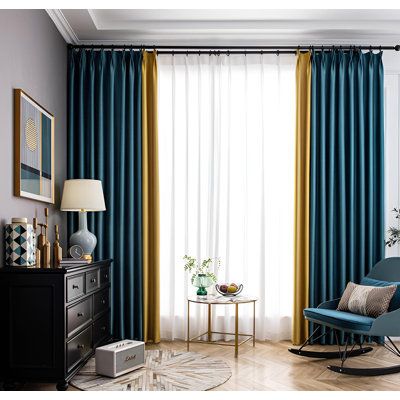 a living room with blue and yellow curtains