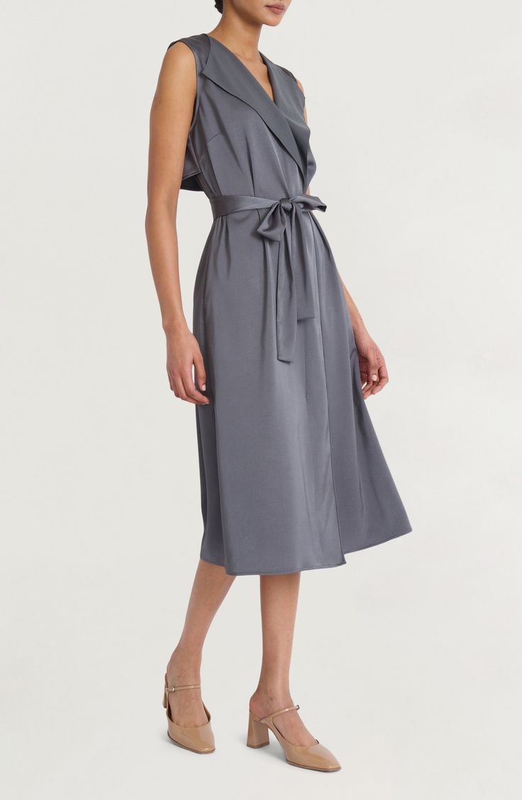 Satin accents lend casual elegance to a modern take on the classic shirtdress silhouette. 47" length (size Medium) True wrap style Surplice V-neck; shawl collar Sleeveless Unlined 100% polyester Machine wash, dry flat Imported Chic Midi Dress With Surplice Neckline For Brunch, Summer Midi Dress With Surplice Neckline For Daywear, Elegant V-neck Sleeveless Dress For Day Out, Classic V-neck Shirt Dress For Work, Knee-length Wrap Dress For Day Out, Classic V-neck Midi Dress For Summer, Elegant V-neck Midi Dress For Daywear, Chic Sleeveless Solid Color Dress For Brunch, Elegant V-neck Dress For Fall Day Out