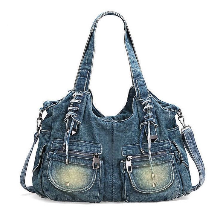 a denim purse with multiple pockets and zippers on the front, is shown against a white background