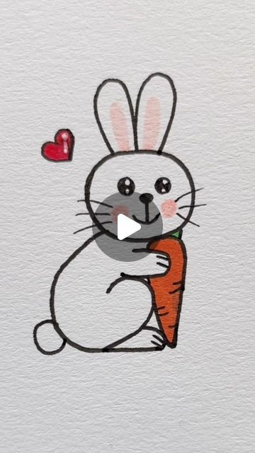 a drawing of a rabbit holding a carrot with a heart on it's back