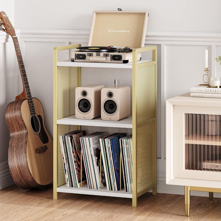 a record player is sitting on top of a shelf next to an open bookcase