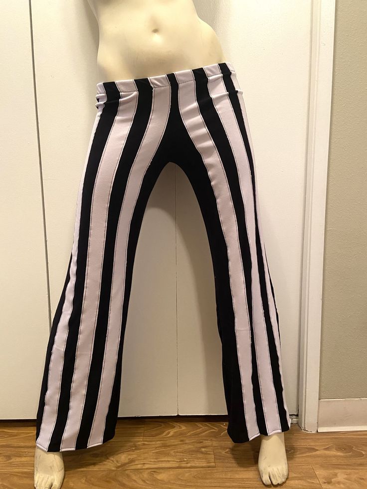 Ready to Ship! Pants Only Size M/L Hips - 35' - 38' Inseam - 31' Length - 39' Hand cut and stitched by sewing machine Made of Black Rayon & Pale Purple Elastic Waistband Black with Pale Purple Stripes - 12 Stripes Very stretchy, soft and comfy HAND WASH COLD AND LINE DRY WILL PRO LONG THE LIFE OF THE PIECE If you have any questions, please feel free to ask at any time Copyright Patched Jester Creations 2021 Black Stretch Pants For Halloween, Black Punk Pants For Halloween, Edgy Stretch Pants For Halloween, Punk High-waisted Halloween Bottoms, Punk Style Bottoms For Halloween Cosplay, Punk Style Stretch Bottoms For Cosplay, Halloween Wide Leg Stretch Bottoms, Halloween Stretch Wide Leg Bottoms, High Waist Black Halloween Bottoms