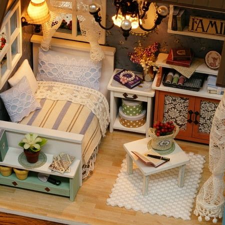 a doll house bedroom with furniture and accessories