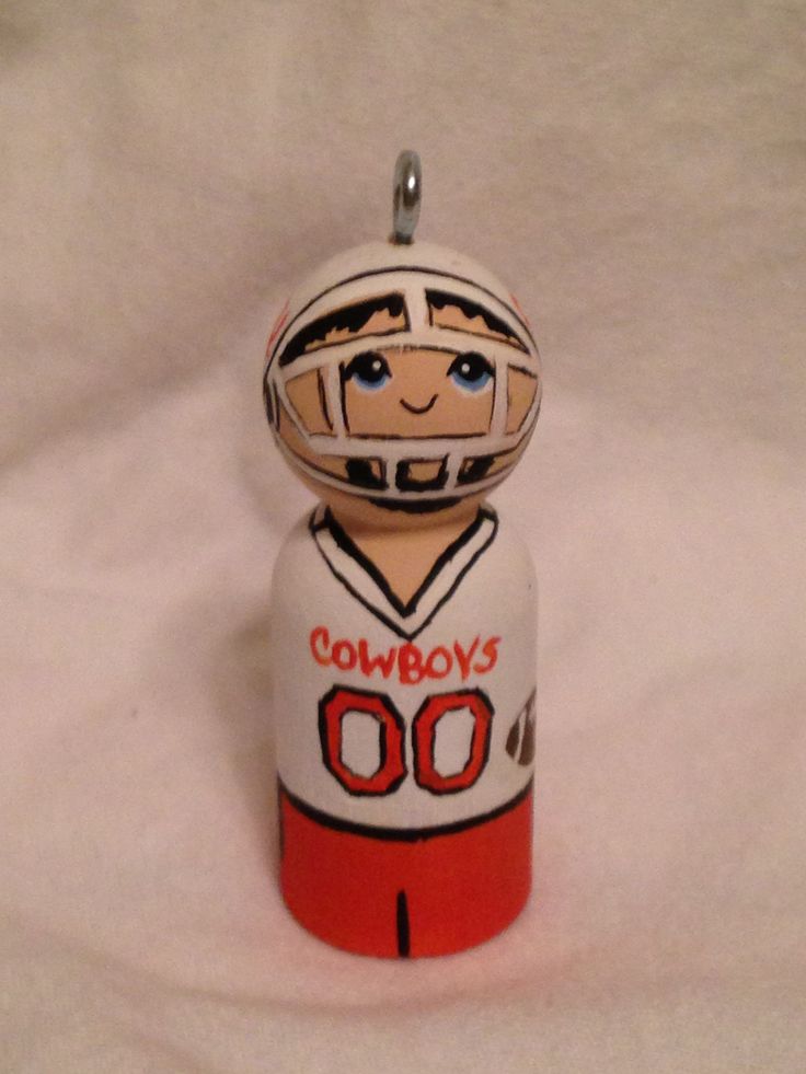 a ceramic ornament with a football player on it's face and name