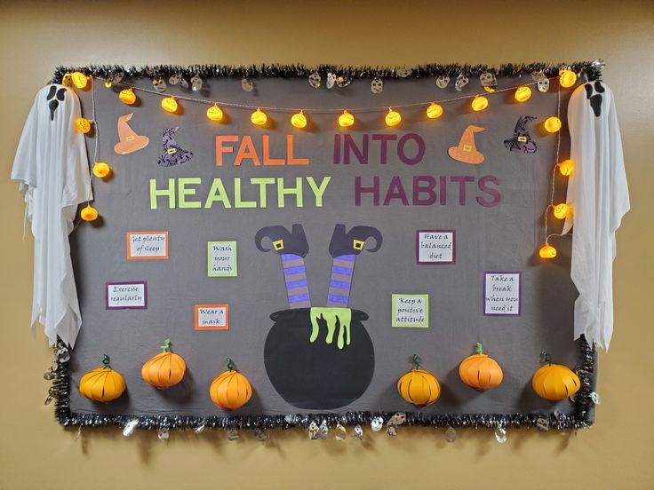 a bulletin board with pumpkins and decorations on it that says fall into healthy habitts