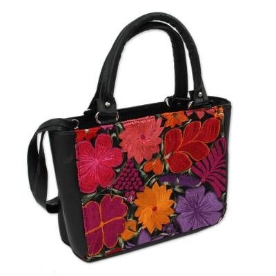 Embroidered with a colorful bouquet of cotton floral motifs this handbag from Mexico is designed by Fabiola Gonzalez. She crafts this bag of leather in a solid black color. It can be held on two handles or a single adjustable strap. Opening with a zipper this handbag features a lined interior with a zipper pocket on one side. Black Bags With Floral Embroidery For Spring, Floral Embroidered Tote Shoulder Bag For Shopping, Black Rectangular Satchel For Spring, Double Handle Leather Bags With Embroidery, Leather Double Handle Embroidered Bag, Embroidered Satchel With Double Handle, Embroidered Leather Satchel Bag, Multicolor Embroidered Bags For Everyday Spring Use, Embroidered Rectangular Satchel